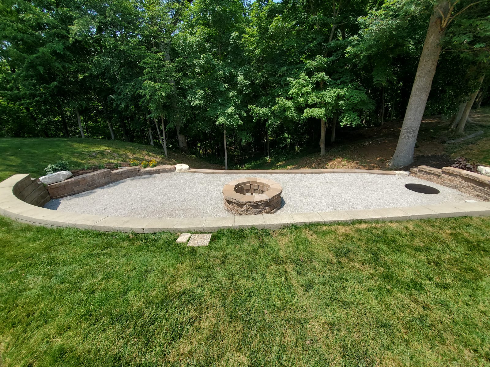 Fire pit patio far end with boulders